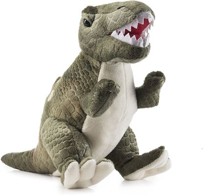 Jouet vert de peluche de tyrannosaure avec de longues dents aiguës un jouet de peluche de dinosaure fait de peluche de cisaillement de relief